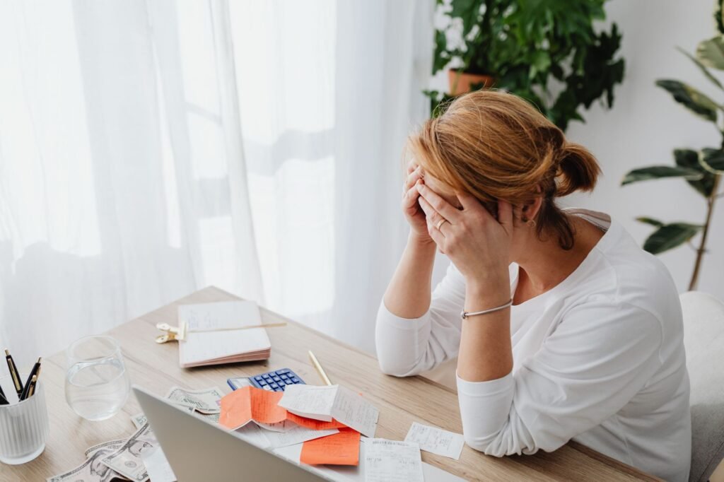 Image showing a person frustrated with an injury claim calculator, representing common mistakes using injury claim calculator