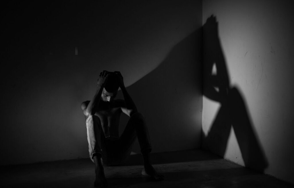 Visual representation of a person experiencing pain, symbolizing quality of life impact. — factors affecting injury clai…
