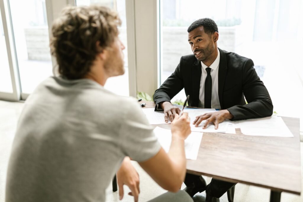 A depiction of a conversation between a claimant and an insurance adjuster. — mistakes in injury claim