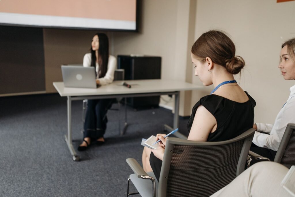 A professional setting where an injury claim settlement meeting is taking place with participants engaged in discussion.