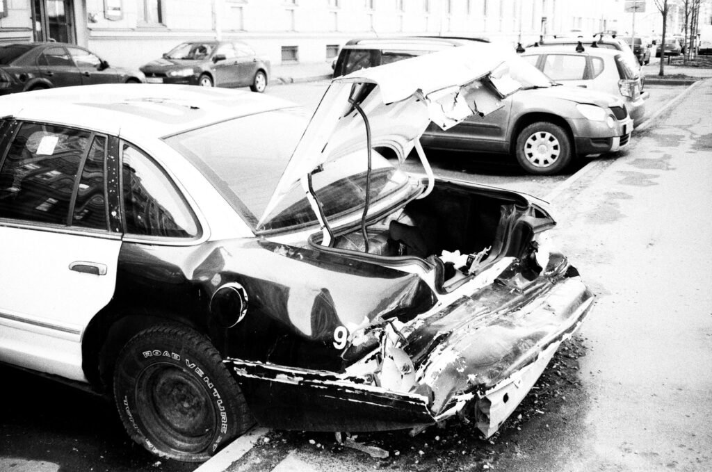 A scene of a car accident being documented with photographs for insurance purposes. — post-accident checklist