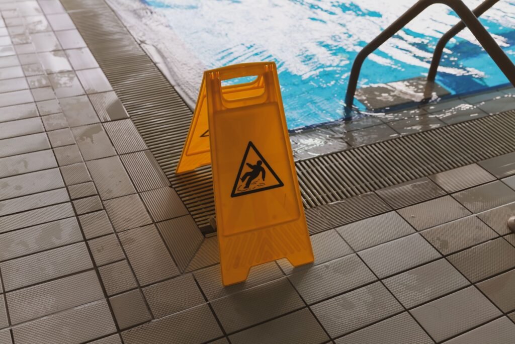An image of a person slipping on a wet floor, representing slip and fall claims. — types of personal injury claims