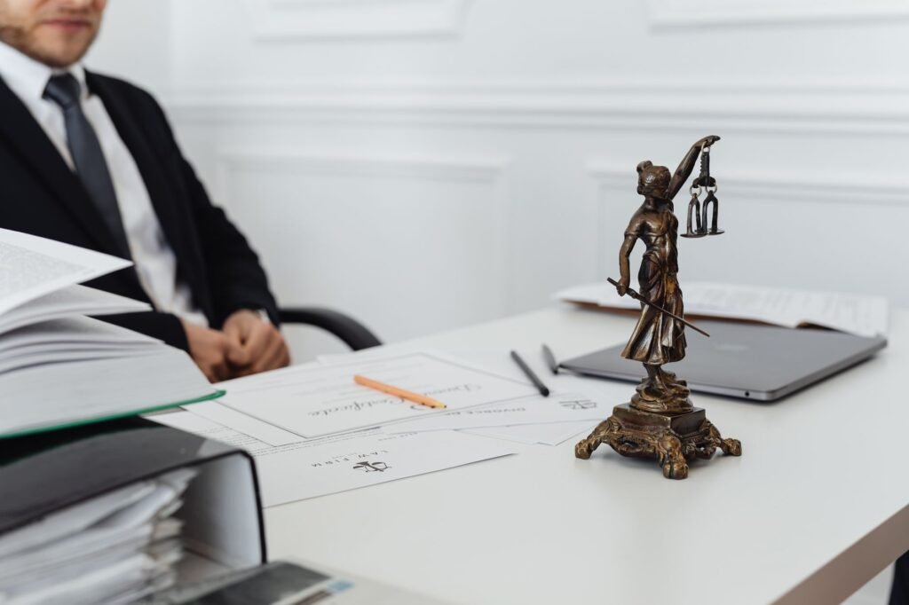 An image showing a gavel and legal documents to represent legal advice related to mistakes in injury claims.