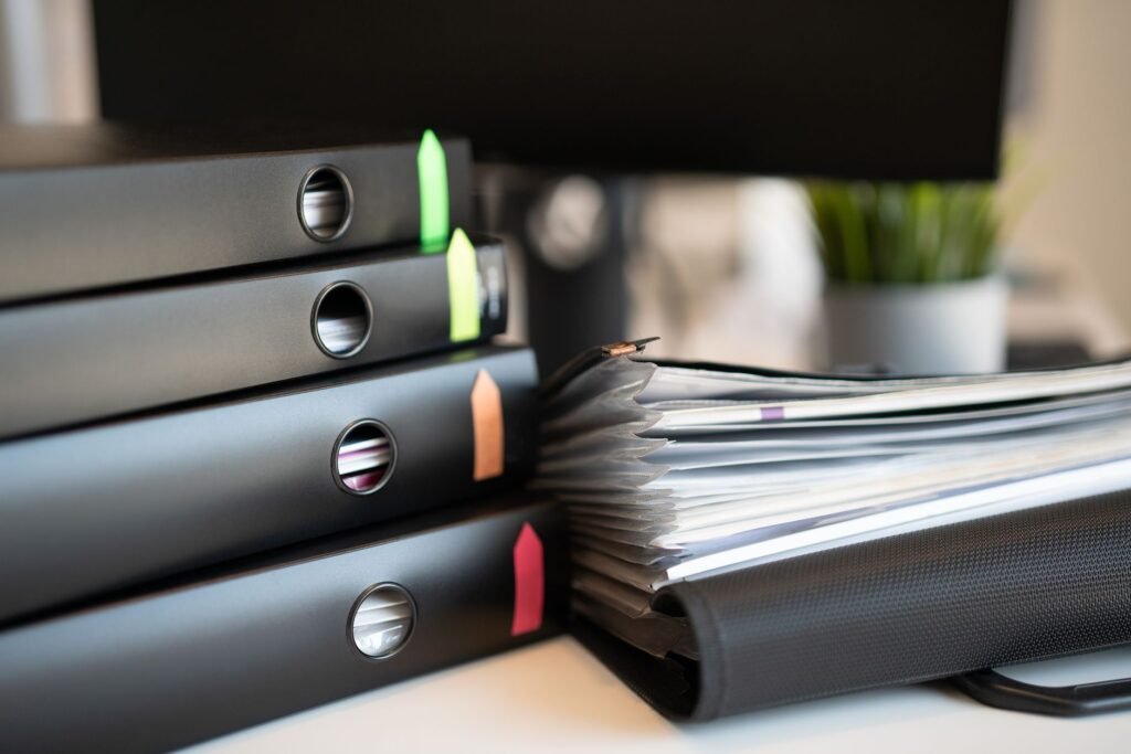 An organized claim file containing various documents related to injury claim documentation.