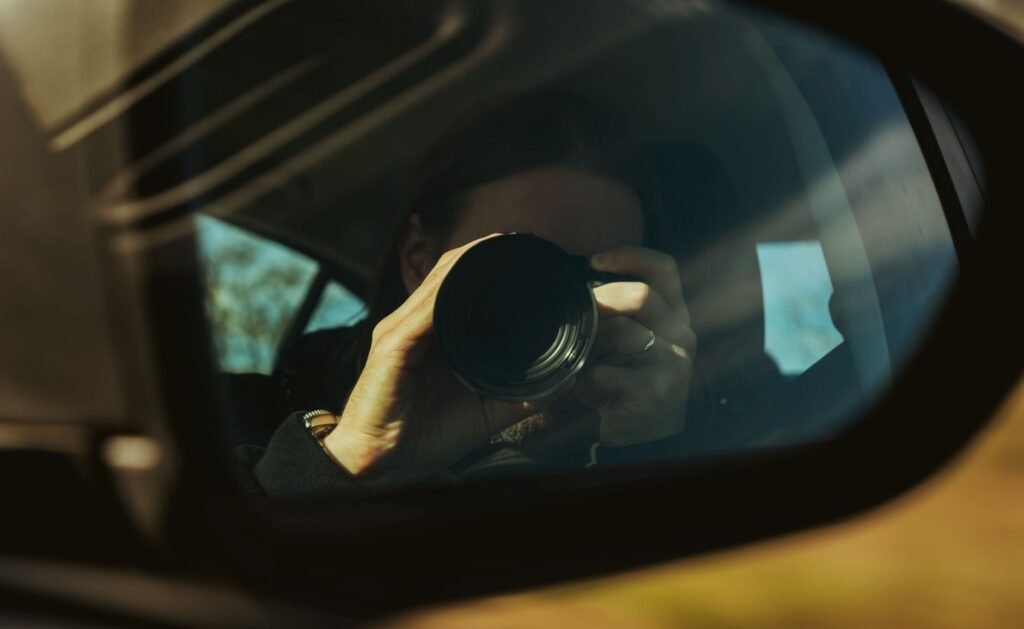 Image of a person documenting an accident scene with a camera. — gather evidence injury claim
