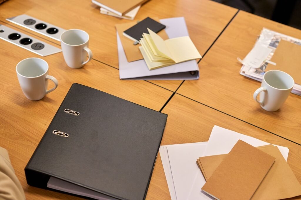 Visual representation of documents and paperwork typically prepared for an injury claim settlement meeting.